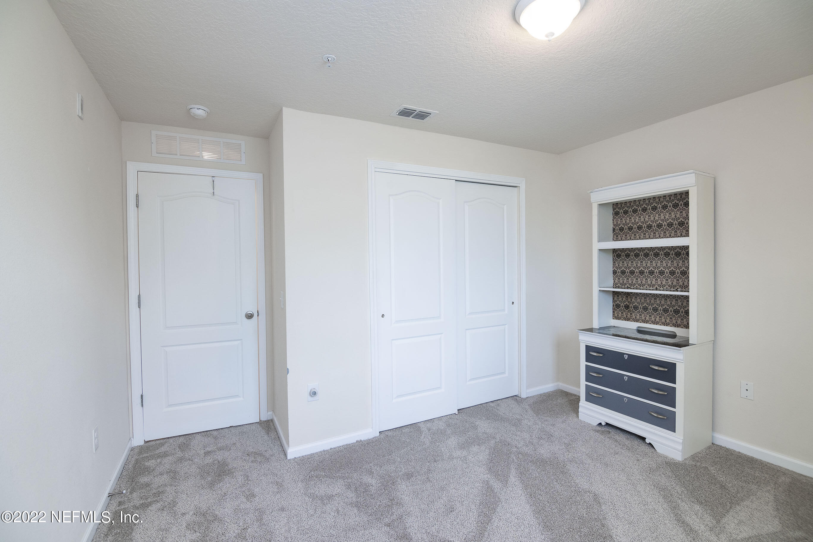 803 Golden Lake Loop St. Augustine, FL 32084 - Photo 20 of 33 a view of room with stairs and a closet