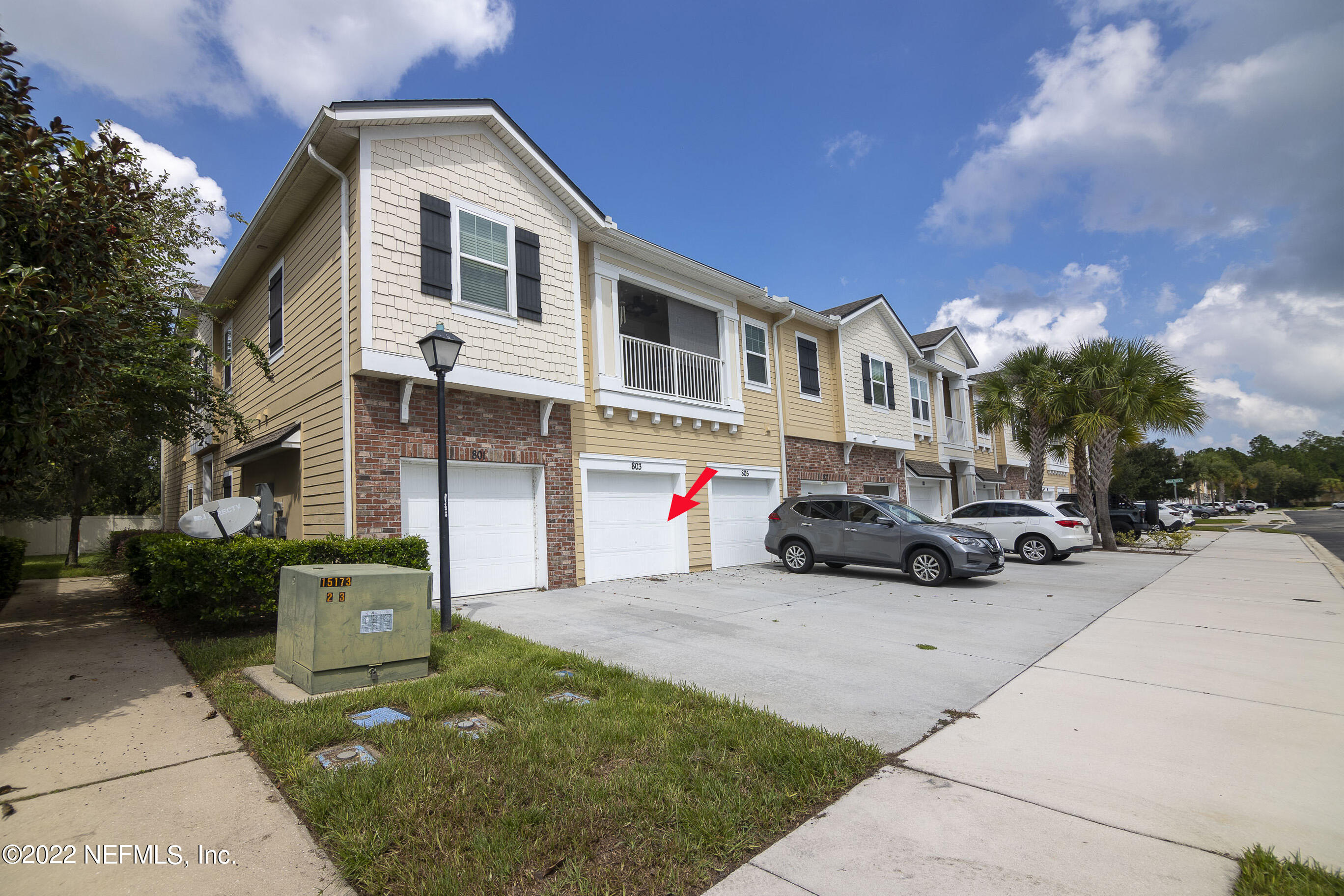 803 Golden Lake Loop St. Augustine, FL 32084 - Photo 2 of 33 a view of a white house with a yard and parking space