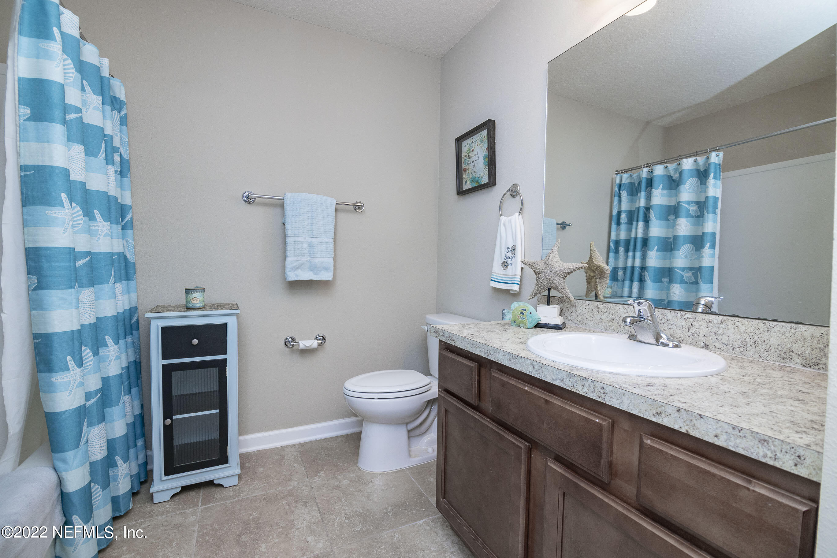 803 Golden Lake Loop St. Augustine, FL 32084 - Photo 21 of 33 a bathroom with a granite countertop sink toilet and shower