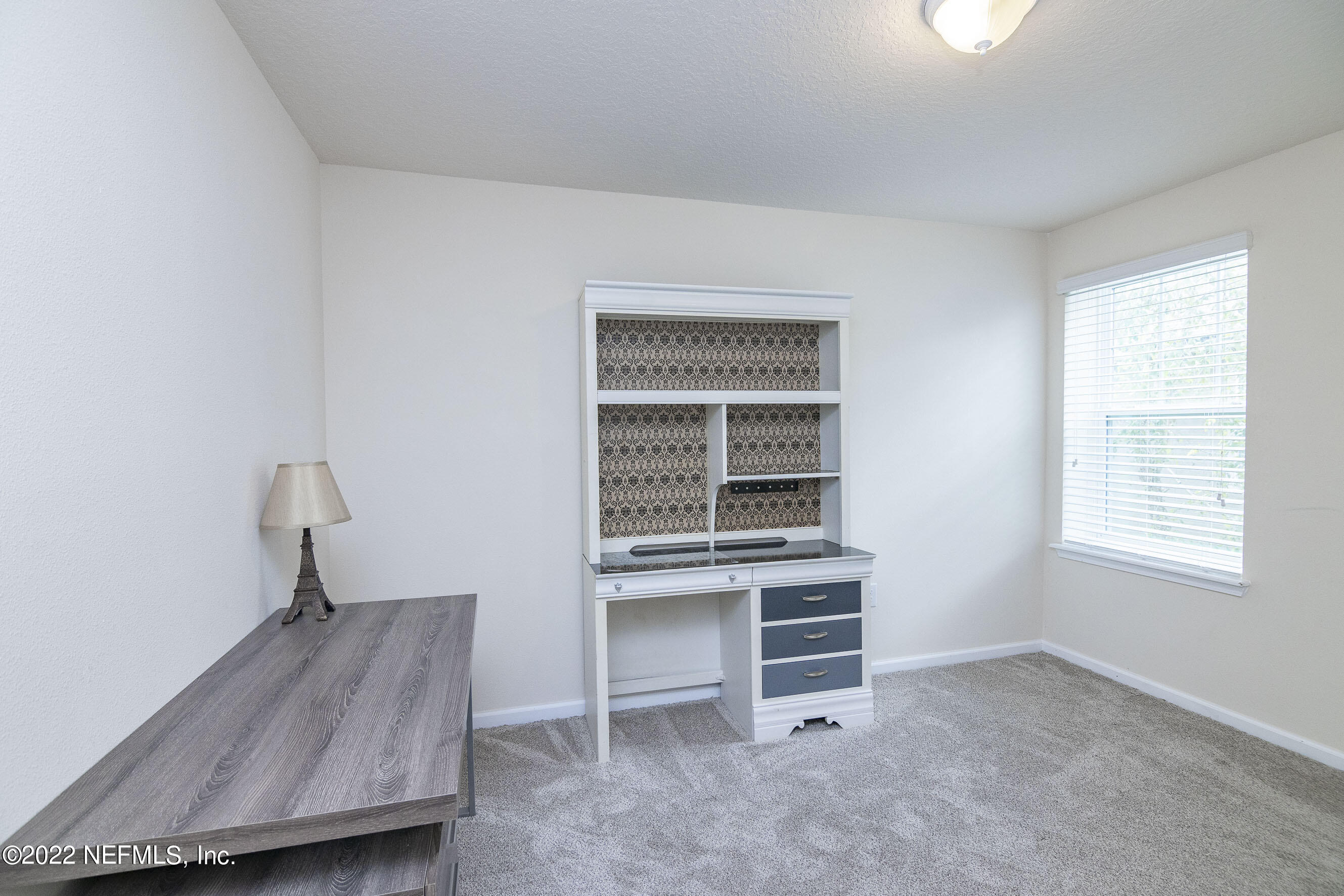 803 Golden Lake Loop St. Augustine, FL 32084 - Photo 23 of 33 a room with furniture and a window