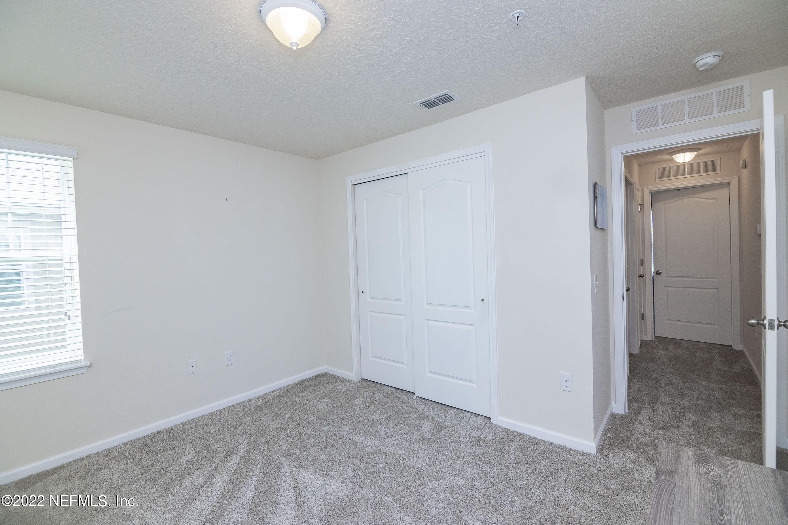 803 Golden Lake Loop St. Augustine, FL 32084 - Photo 24 of 33 a view of an empty room and window
