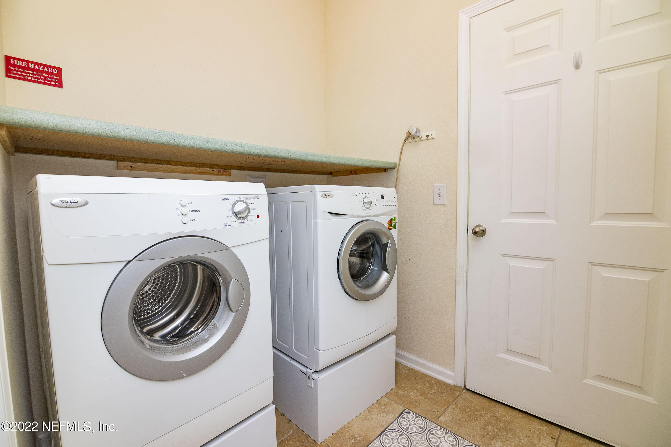 803 Golden Lake Loop St. Augustine, FL 32084 - Photo 26 of 33 a utility room with dryer and washer