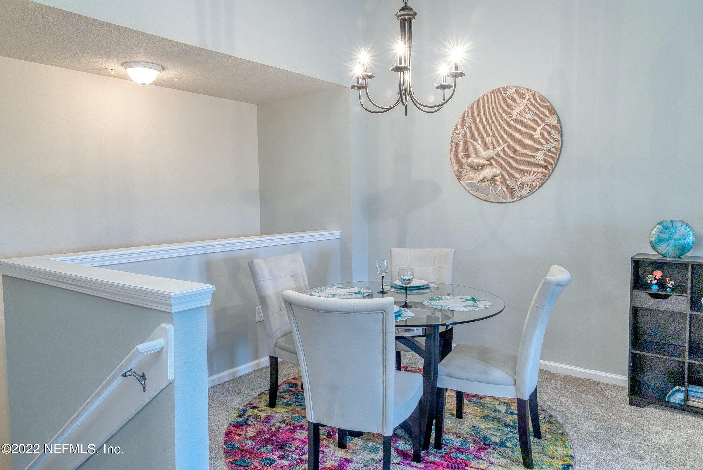 803 Golden Lake Loop St. Augustine, FL 32084 - Photo 3 of 33 a view of a dining room with furniture and chandelier