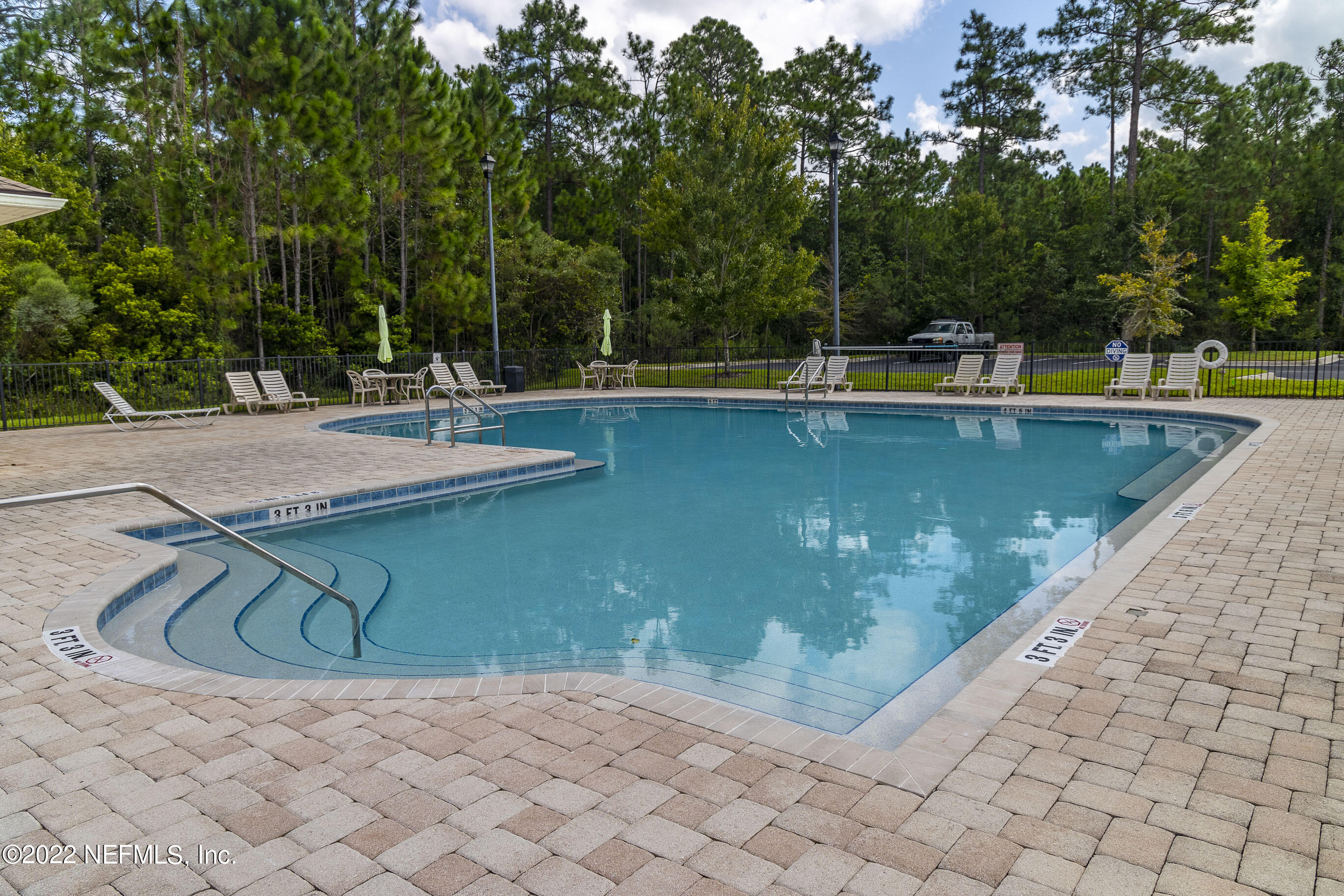 803 Golden Lake Loop St. Augustine, FL 32084 - Photo 31 of 33 a view of a swimming pool with a yard