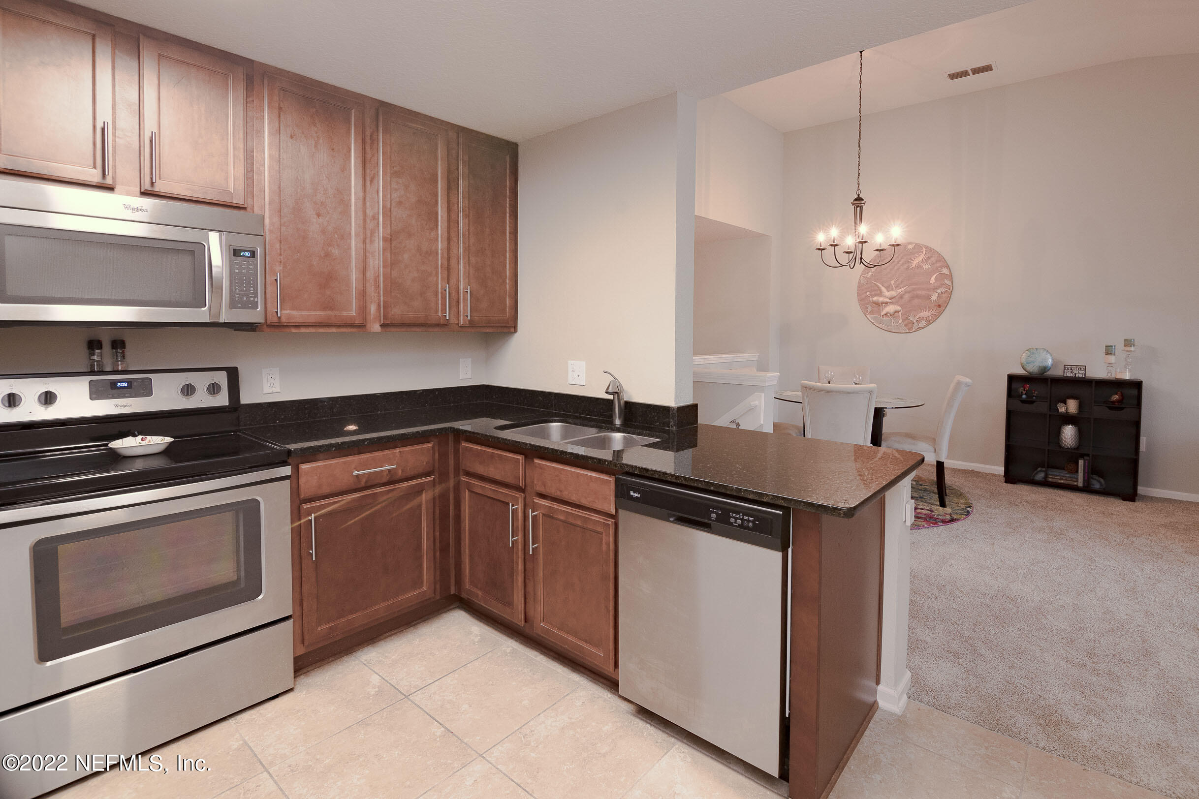 803 Golden Lake Loop St. Augustine, FL 32084 - Photo 10 of 33 a kitchen with stainless steel appliances granite countertop a sink and a stove