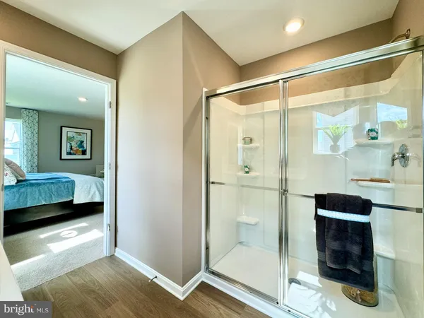 a bathroom with a sink a large mirror and a toilet
