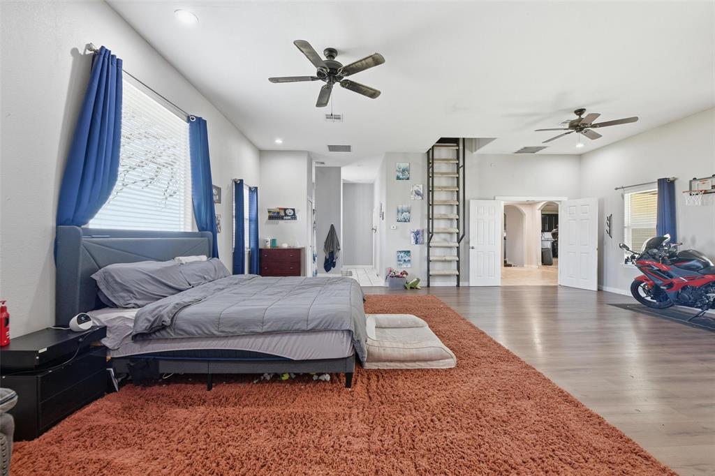 379 Private Road, Unit 4650 Boyd, TX 76023 - Photo 13 of 40 Bedroom with wood finished floors, recessed lighting, and arched walkways