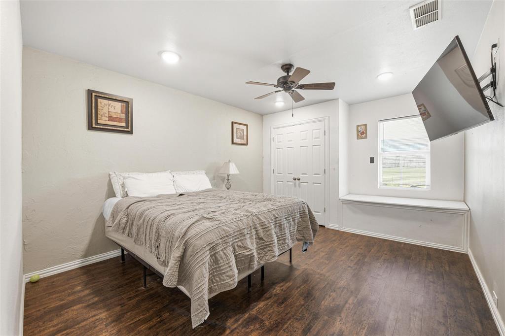 379 Private Road, Unit 4650 Boyd, TX 76023 - Photo 25 of 40 Bedroom with dark wood finished floors, a ceiling fan, and a closet