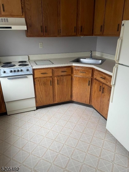 37 East Main Street, Unit 8 Rockaway, NJ 07866 - Photo 4 of 9 a view of a kitchen with cabinets