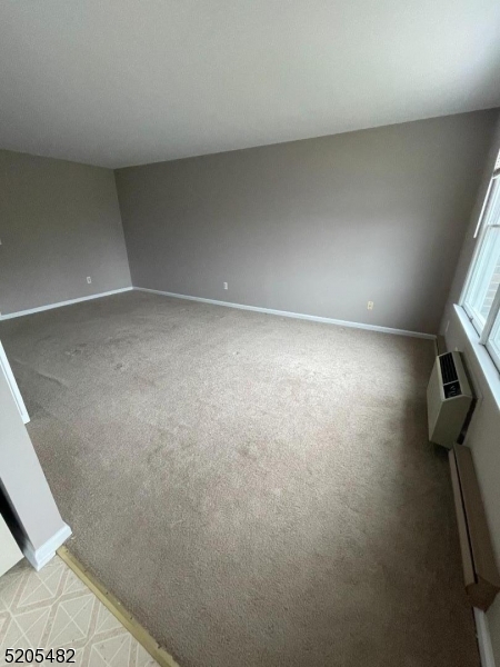 37 East Main Street, Unit 8 Rockaway, NJ 07866 - Photo 6 of 9 a view of a room with racks on the wall