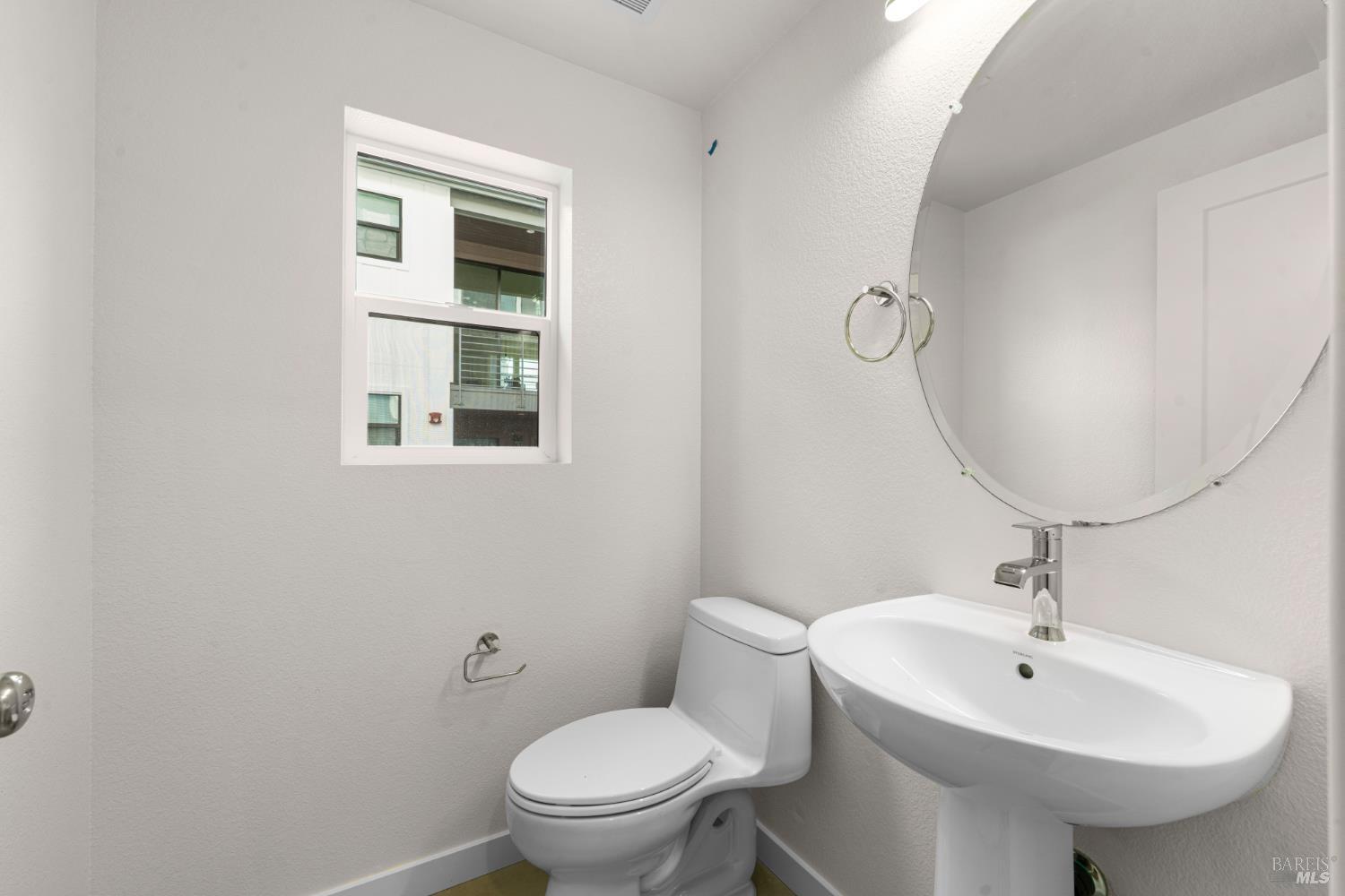 1448 Waterside Lane Rohnert Park, CA 94928 - Photo 33 of 35 a bathroom with a sink toilet and mirror