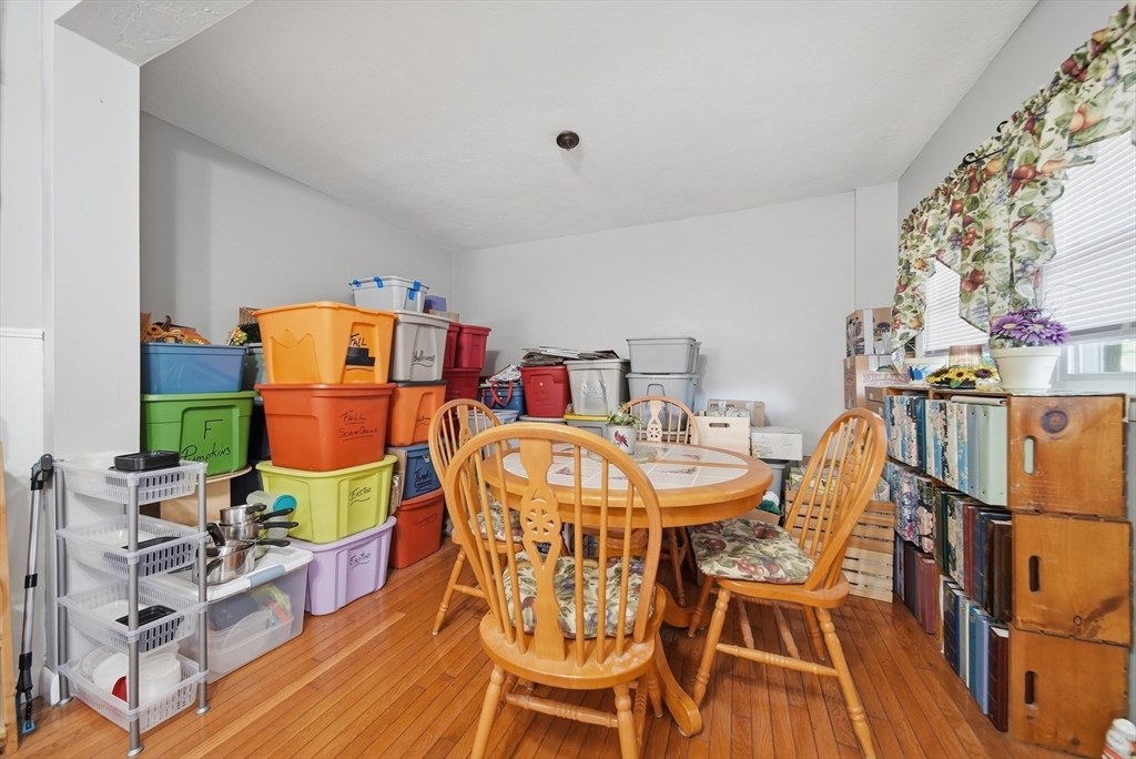 436 Franklin Road Fitchburg, MA 01420 - Photo 11 of 41 a dining room with furniture a rug and wooden floor