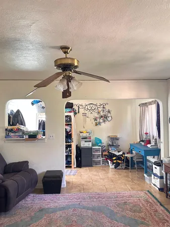 a view of a livingroom with furniture window and wooden floor