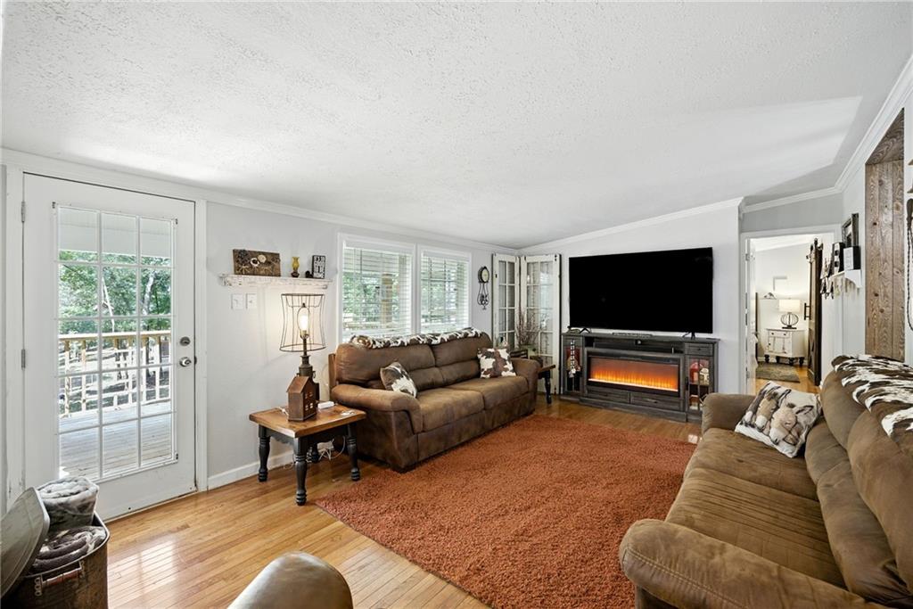 731 Borders Road Commerce, GA 30530 - Photo 35 of 75 a living room with furniture and a flat screen tv