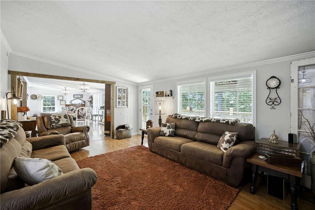 731 Borders Road Commerce, GA 30530 - Photo 36 of 75 a living room with furniture and a large window