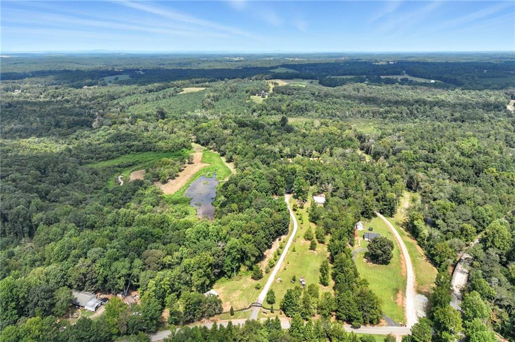 731 Borders Road Commerce, GA 30530 - Photo 53 of 75 an aerial view of residential houses with outdoor space and trees