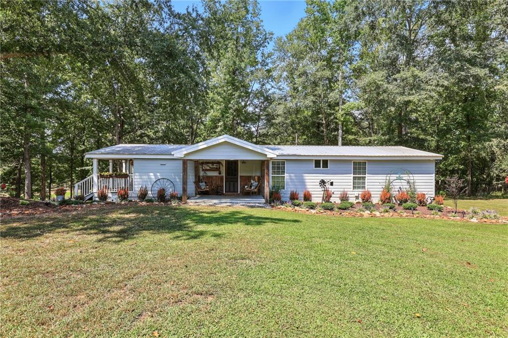 731 Borders Road Commerce, GA 30530 - Photo 6 of 75 a front view of a house with a yard