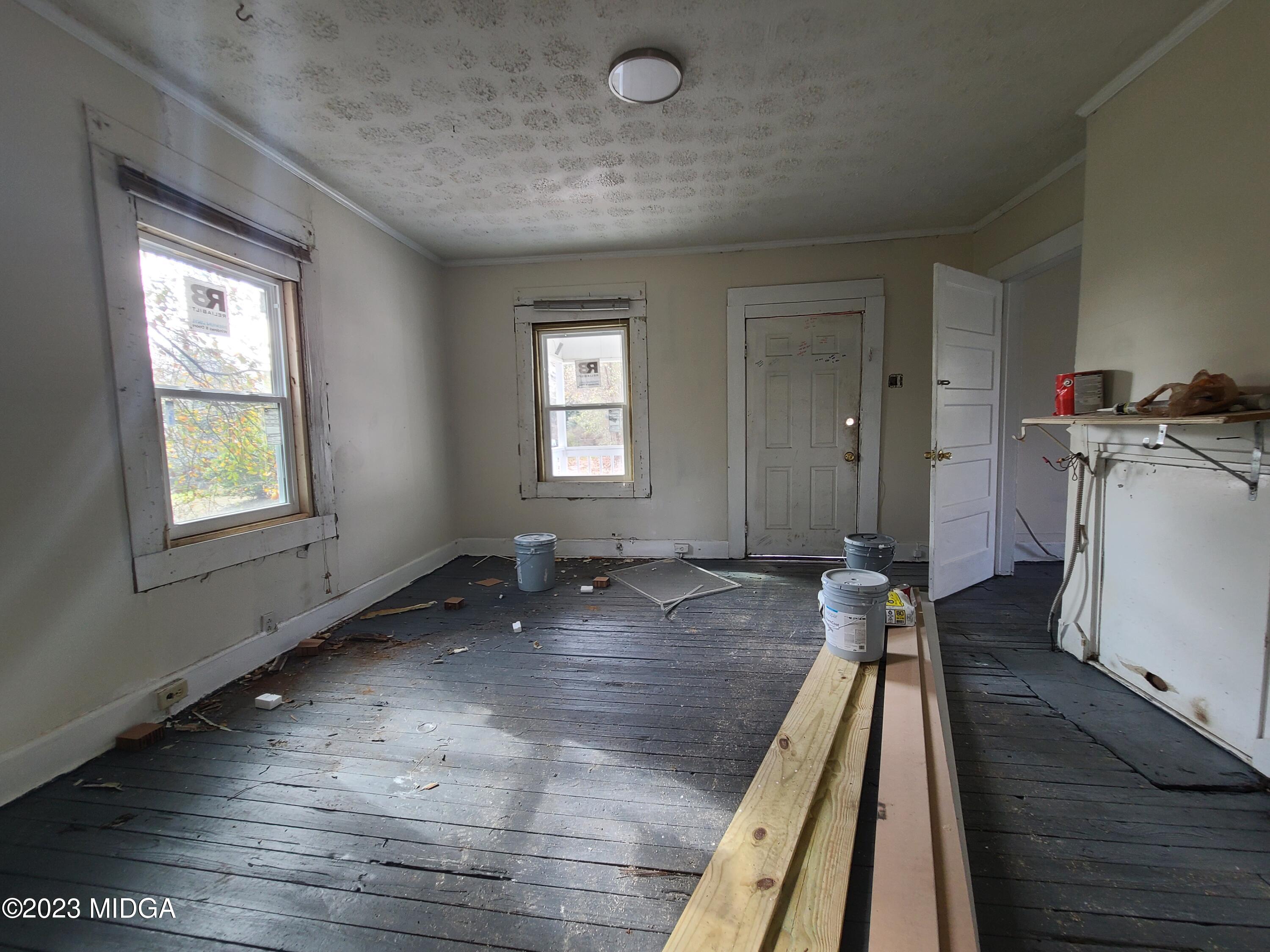 424 Pansy Avenue Macon, GA 31204 - Photo 13 of 19 a view of a livingroom with wooden floor and a window