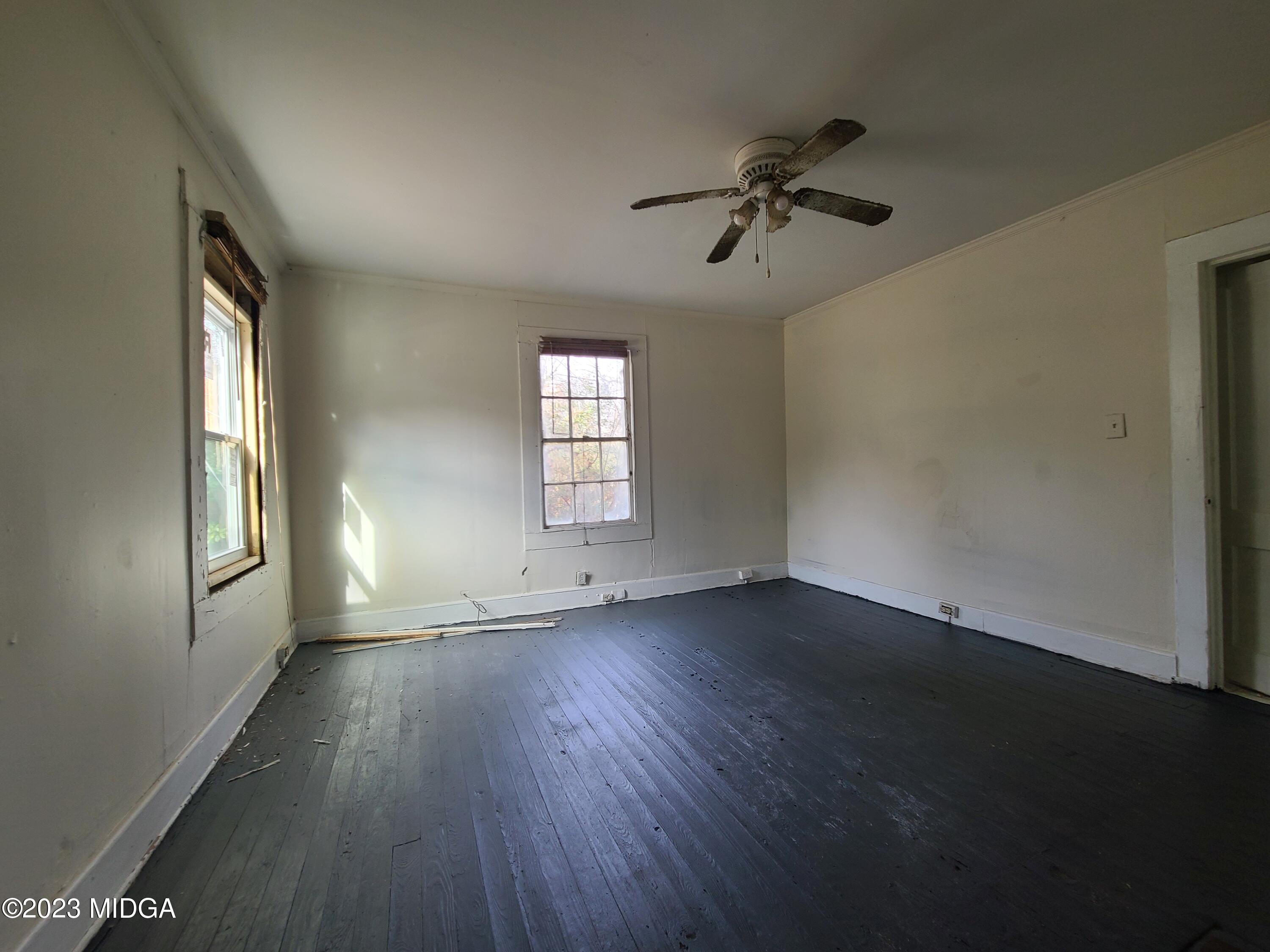 424 Pansy Avenue Macon, GA 31204 - Photo 15 of 19 a view of an empty room with a window and wooden floor