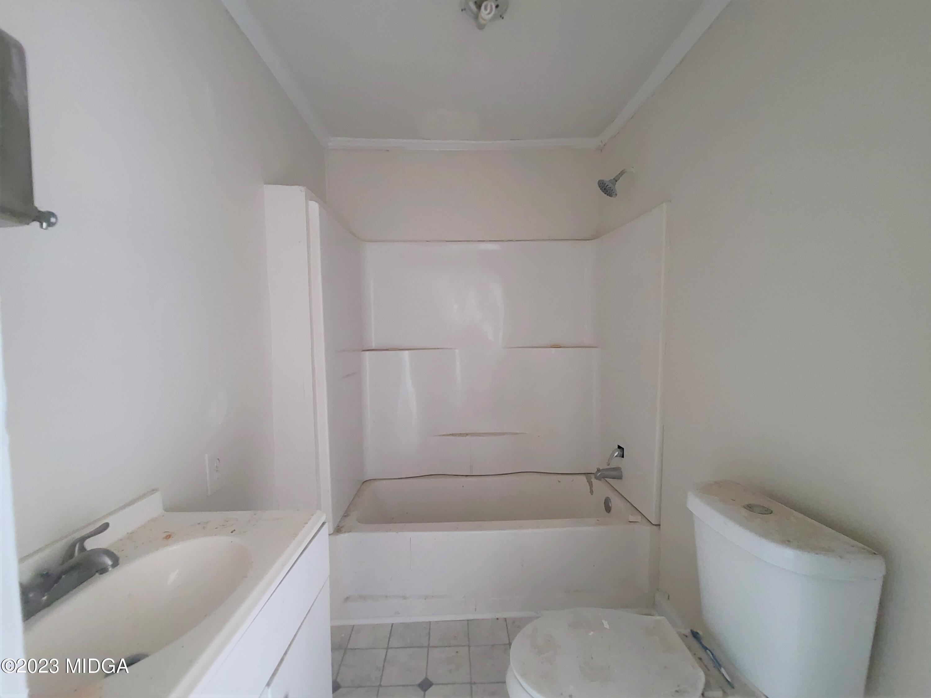 424 Pansy Avenue Macon, GA 31204 - Photo 19 of 19 a bathroom with a sink a toilet and bathtub