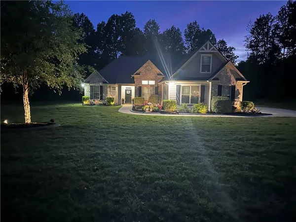 a front view of a house with a yard