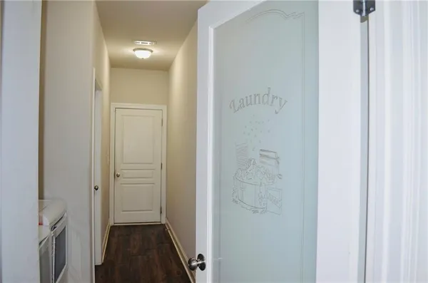 a view of a dining room with furniture and a window