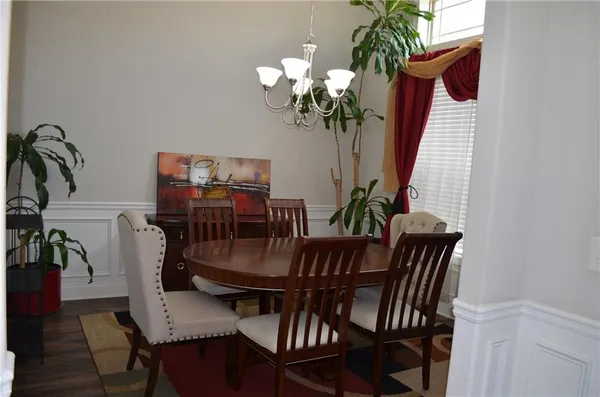 a spacious bathroom with a granite countertop double vanity
