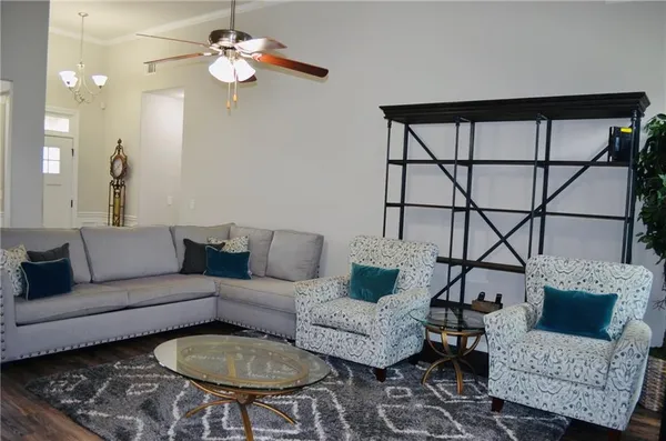a living room with furniture and a fireplace