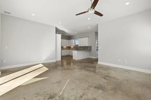 a view of a kitchen with a sink and a window