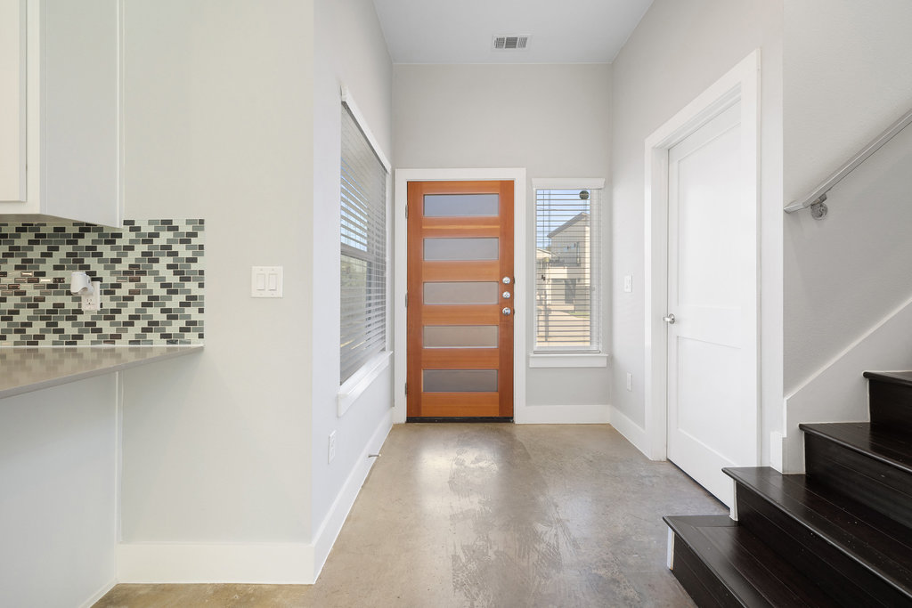 6301 Santos Street, Unit A Austin, TX 78741 - Photo 16 of 37 a view of an empty room with wooden floor and a window