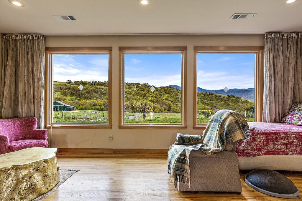 2025 Butler Creek Road Ashland, OR 97520 - Photo 13 of 49 Sit in your living room and enjoy the views of the open Oak Woodlands and grasslands, the Siskiyous and beautiful Wagner Butte.