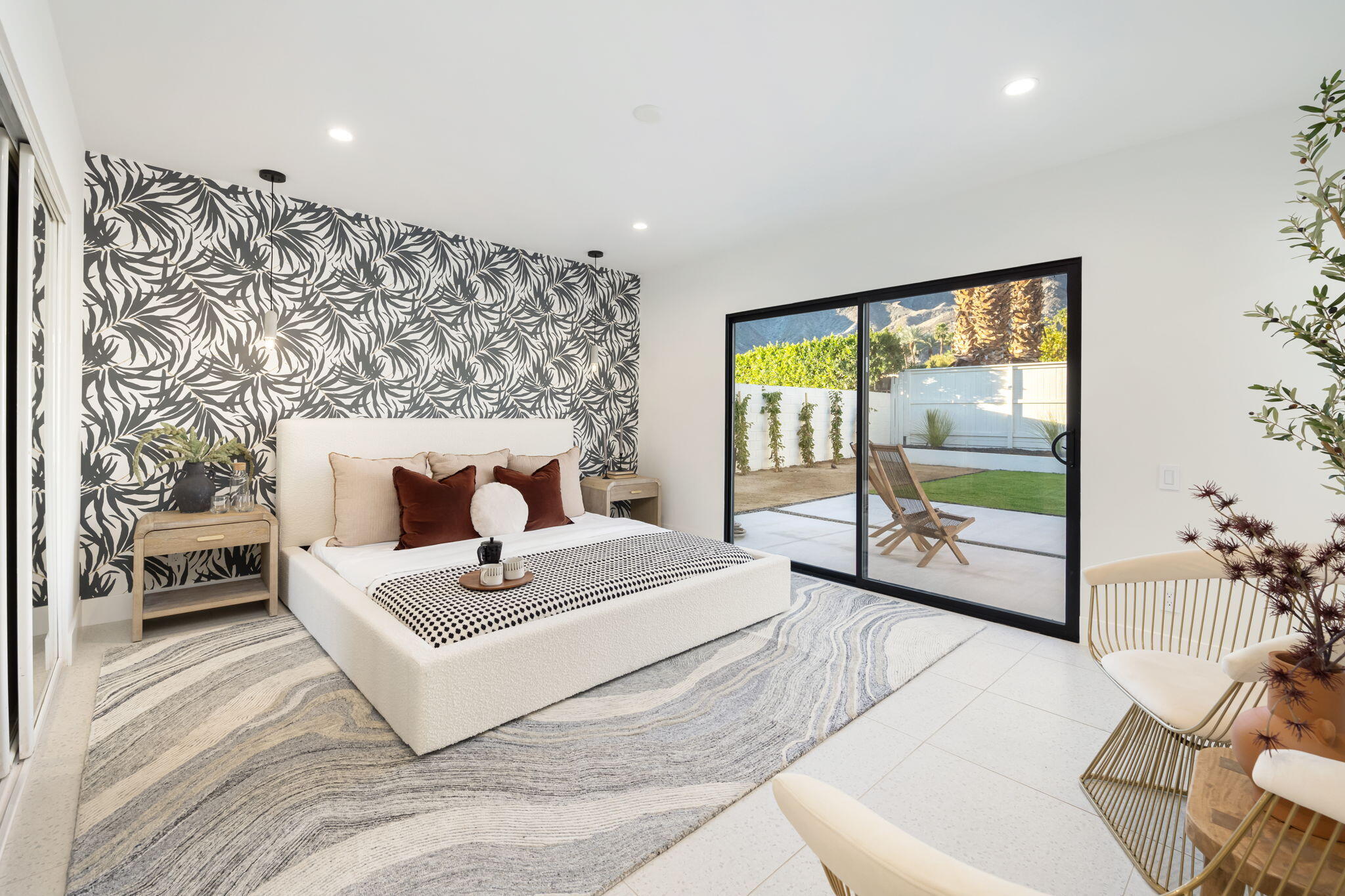 71459 Halgar Road Rancho Mirage, CA 92270 - Photo 13 of 46 a living room with a large window and a couch