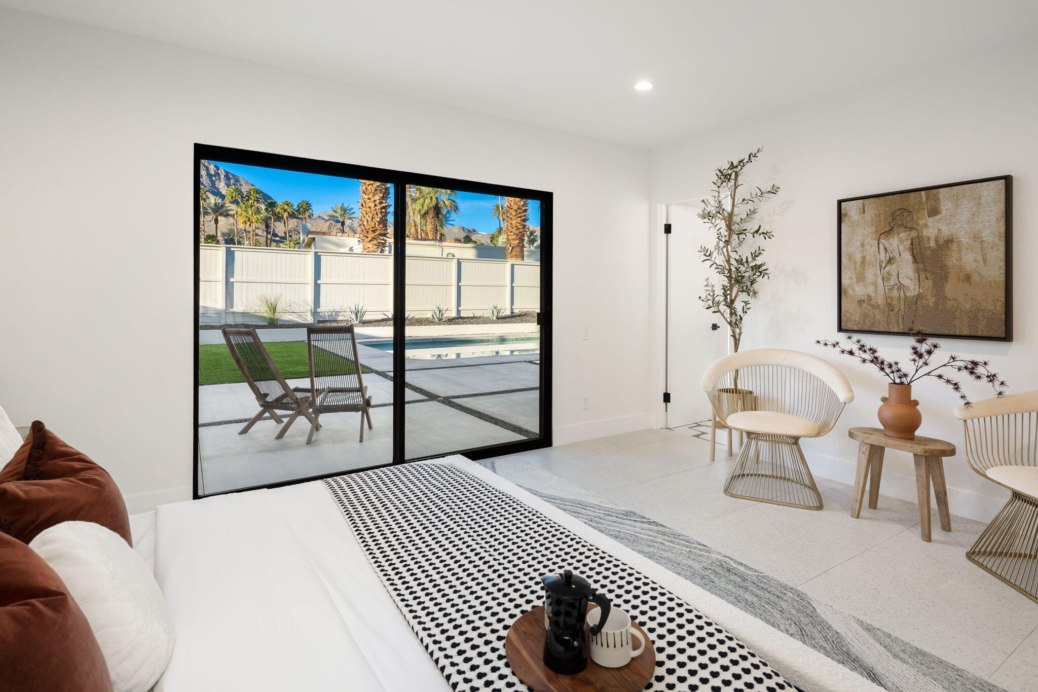 71459 Halgar Road Rancho Mirage, CA 92270 - Photo 14 of 46 a bedroom with furniture and a large window