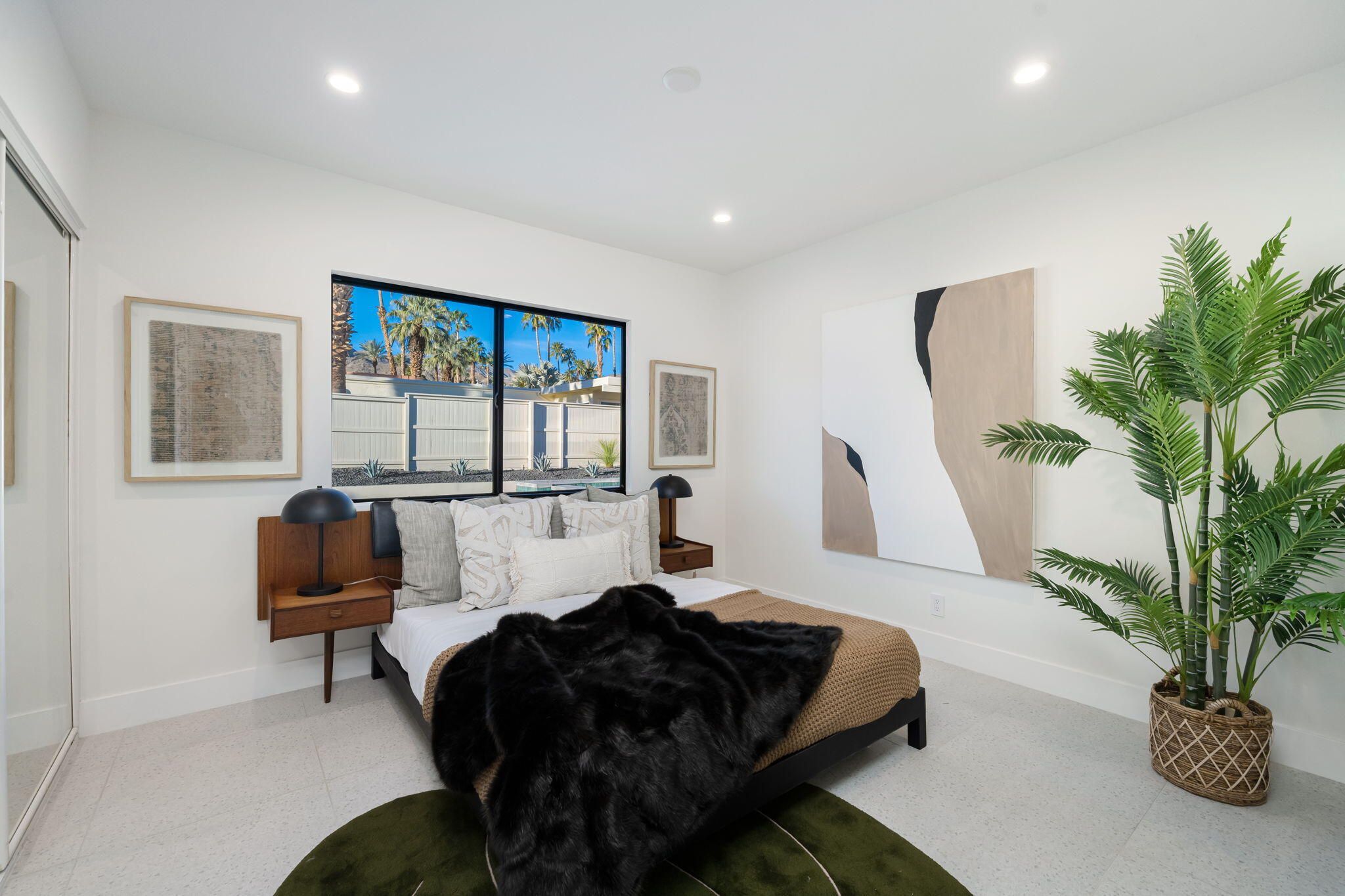 71459 Halgar Road Rancho Mirage, CA 92270 - Photo 19 of 46 a living room with furniture and a potted plant