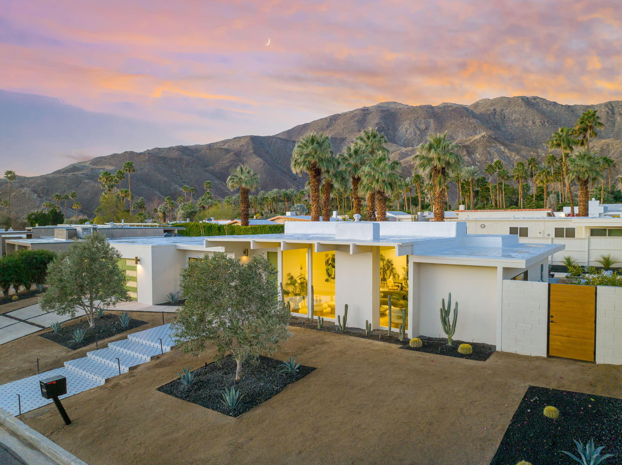 71459 Halgar Road Rancho Mirage, CA 92270 - Photo 2 of 46 a view of a house with a yard and a large tree