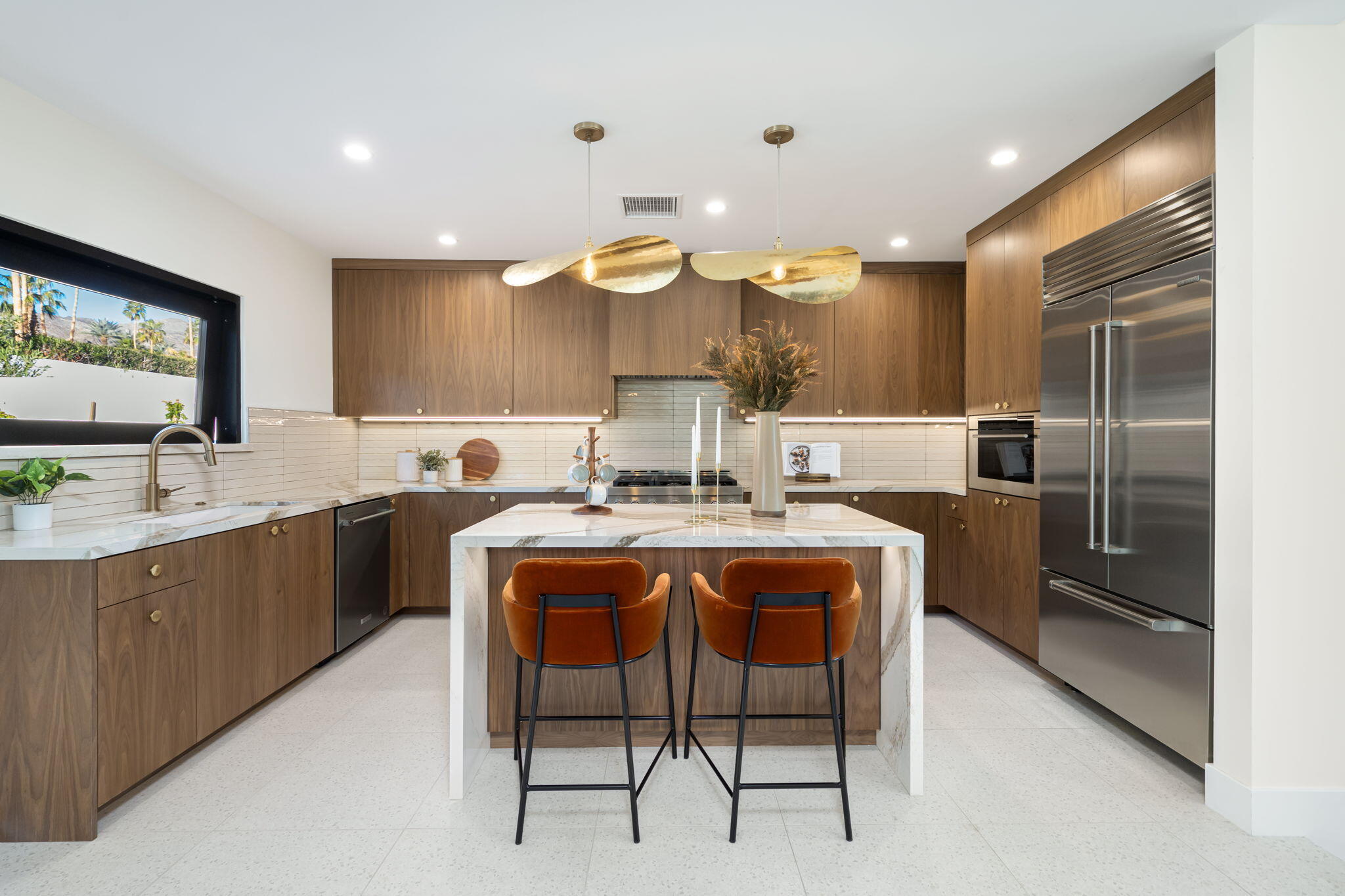 71459 Halgar Road Rancho Mirage, CA 92270 - Photo 25 of 46 a kitchen with stainless steel appliances granite countertop a sink a stove a refrigerator and island