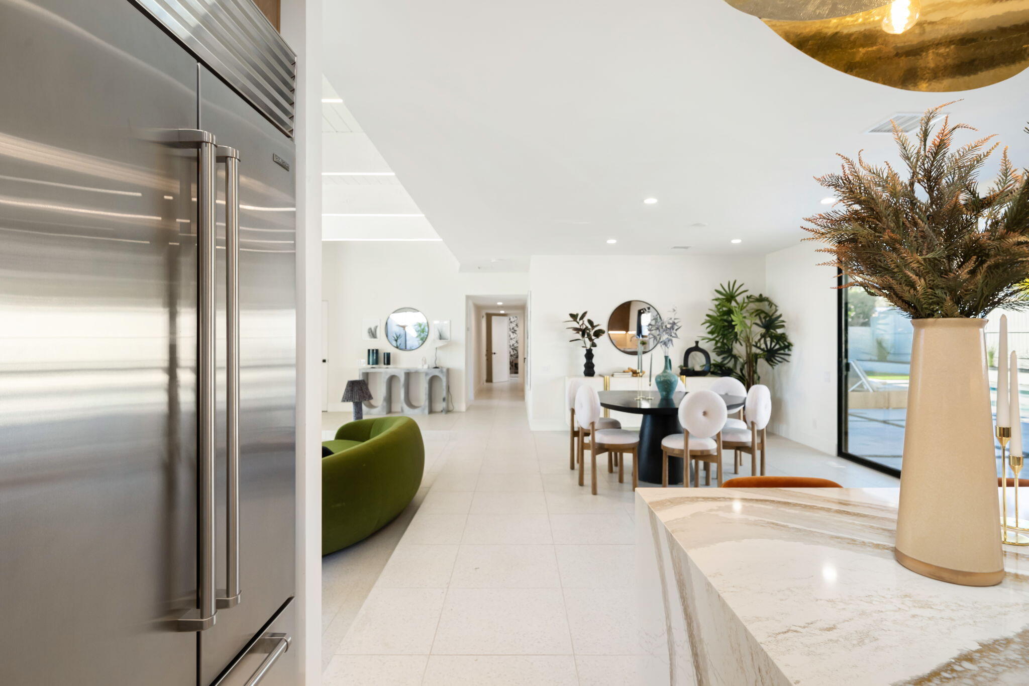 71459 Halgar Road Rancho Mirage, CA 92270 - Photo 31 of 46 a living room with furniture a chandelier and a fireplace