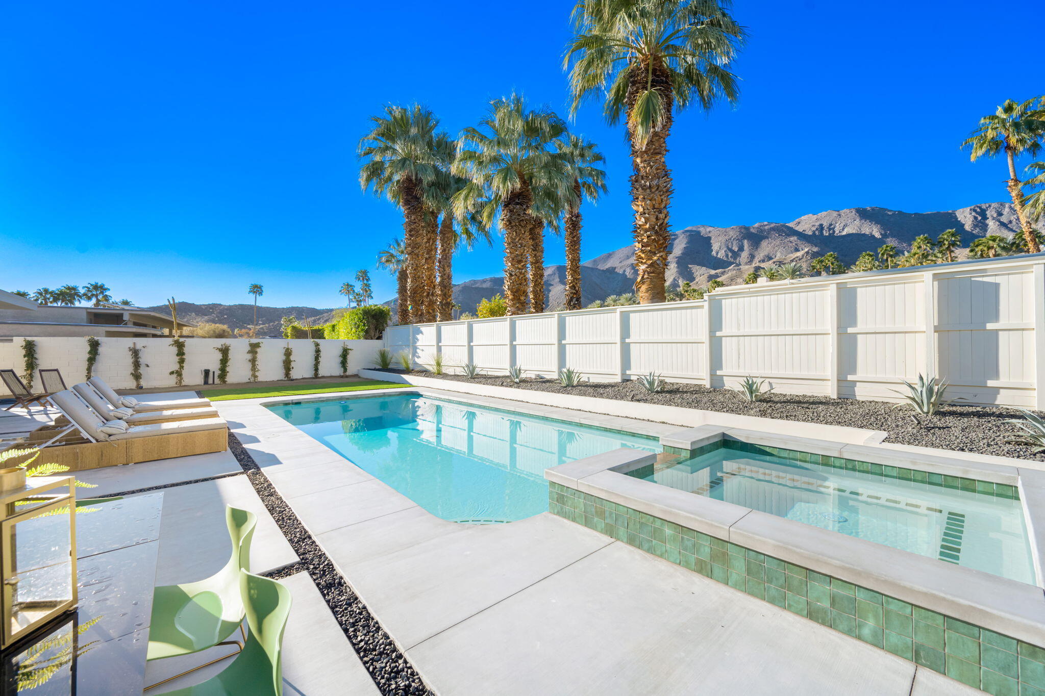 71459 Halgar Road Rancho Mirage, CA 92270 - Photo 38 of 46 a view of a swimming pool with a lounge chairs