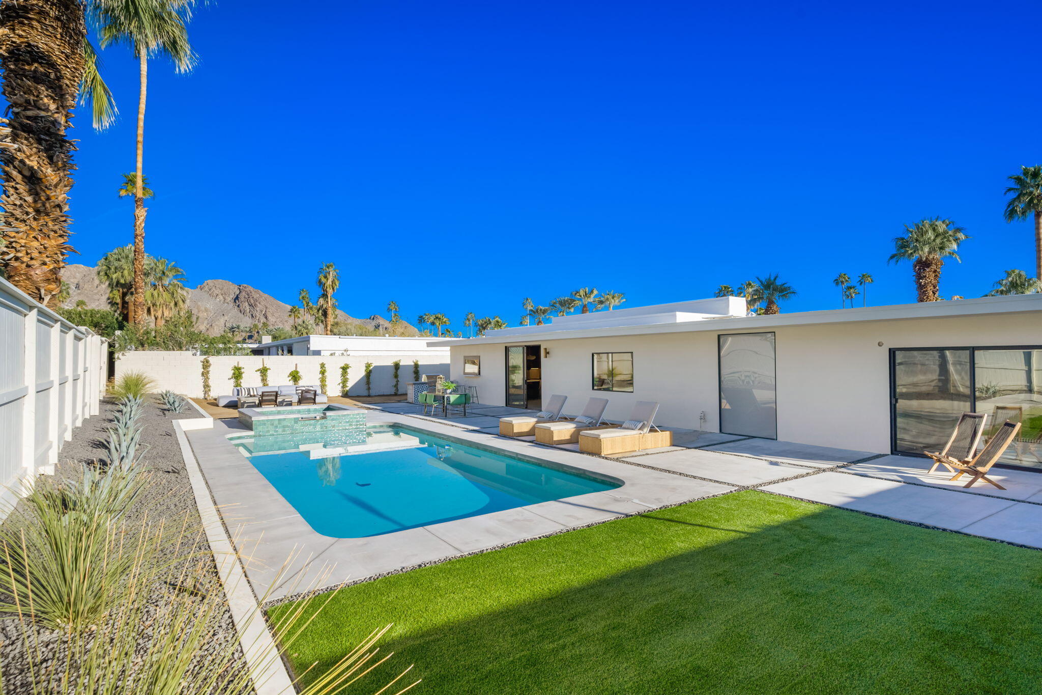 71459 Halgar Road Rancho Mirage, CA 92270 - Photo 40 of 46 a view of a house with backyard porch and sitting area