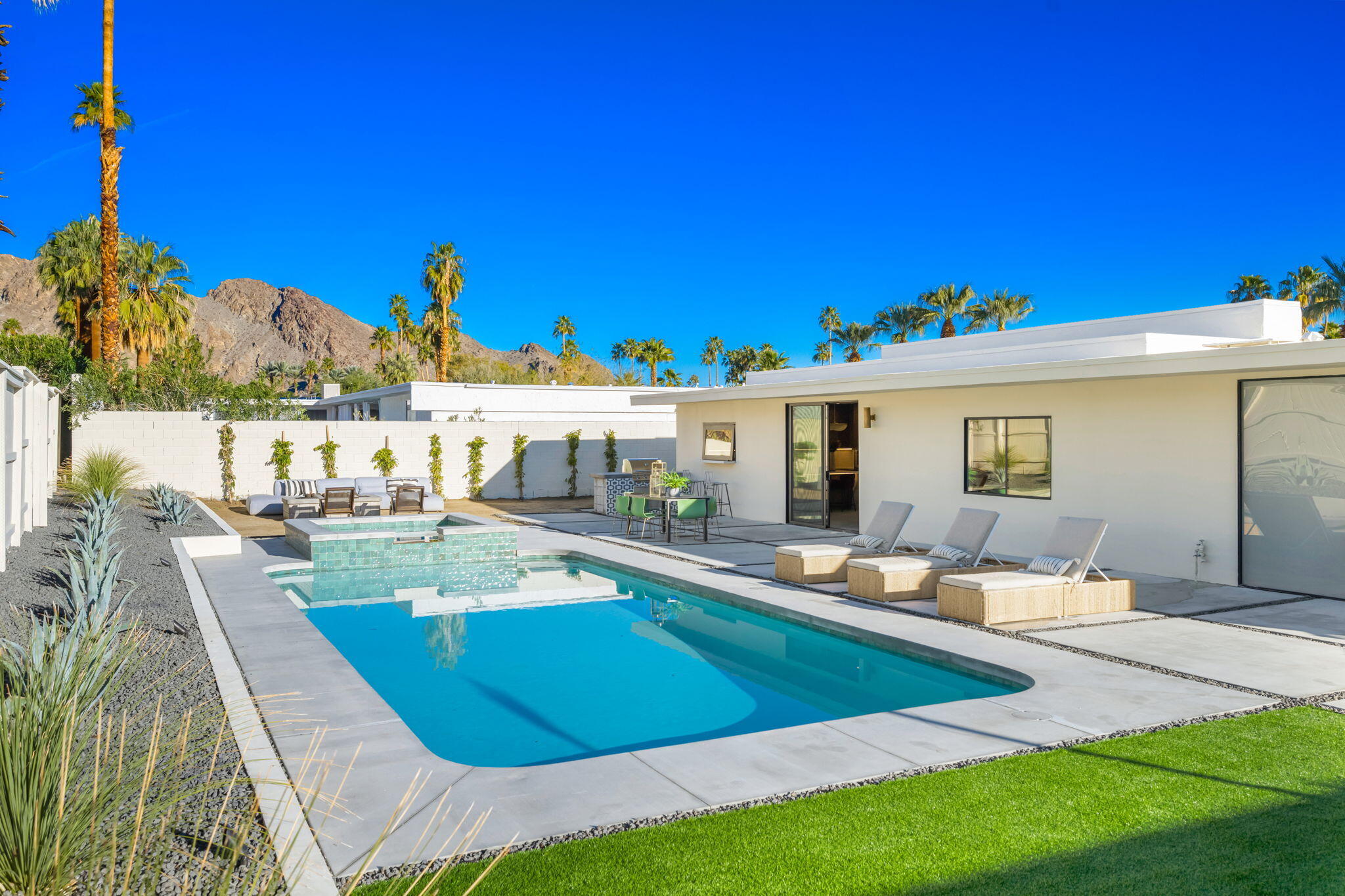 71459 Halgar Road Rancho Mirage, CA 92270 - Photo 41 of 46 a view of a house with swimming pool and sitting area