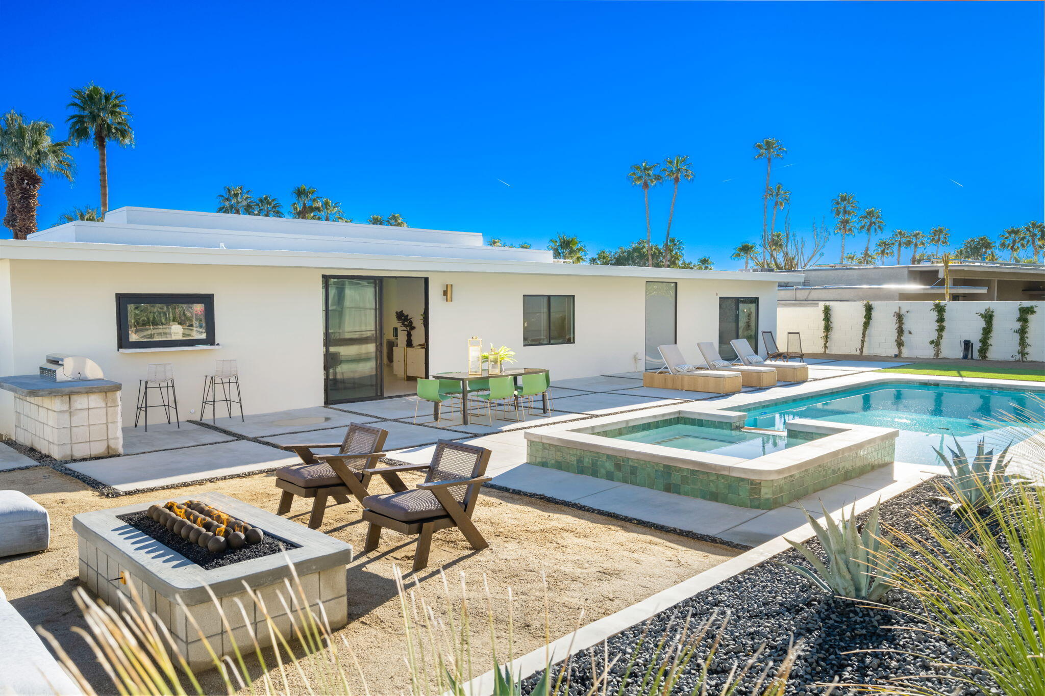 71459 Halgar Road Rancho Mirage, CA 92270 - Photo 42 of 46 a view of a house with swimming pool and sitting area