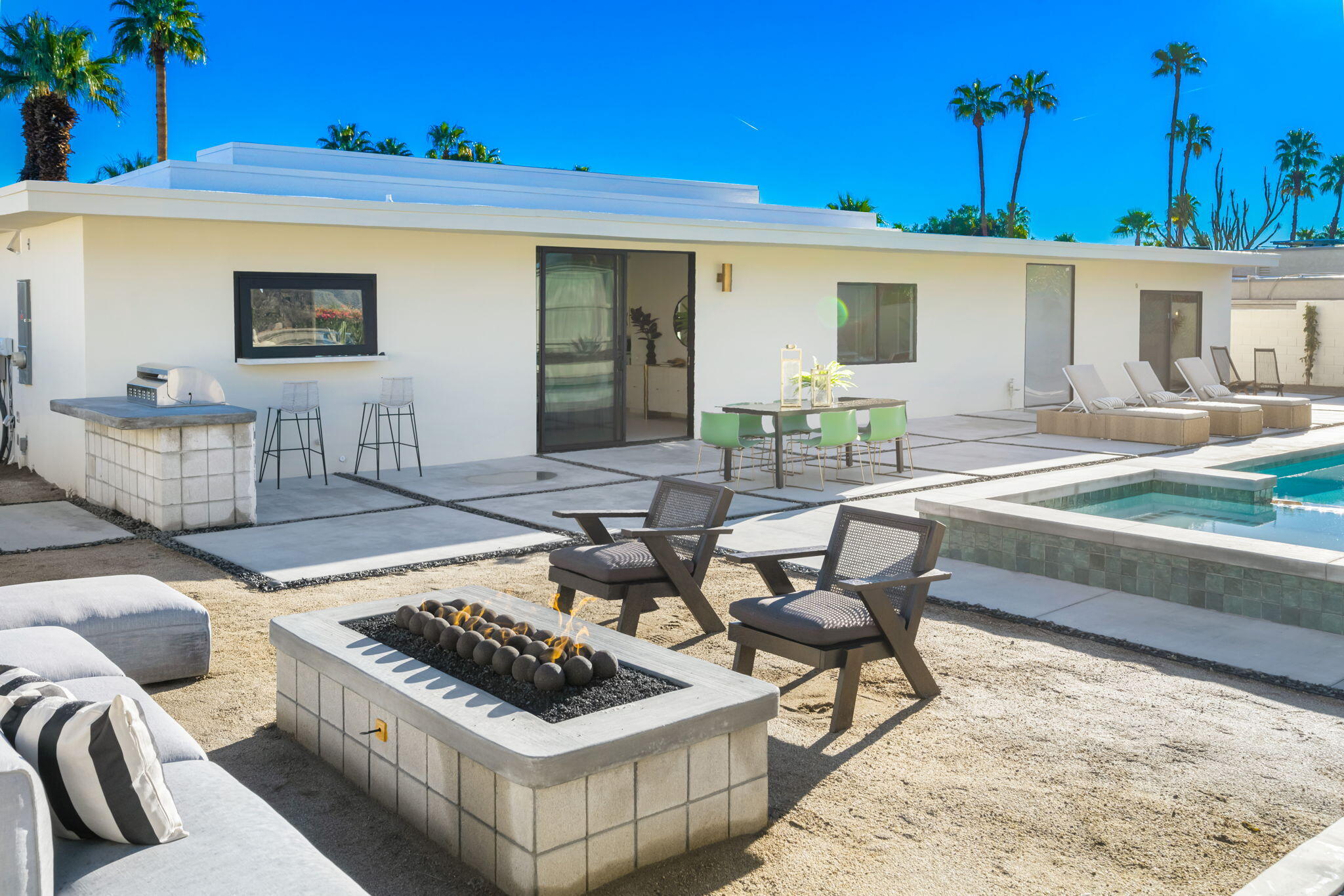 71459 Halgar Road Rancho Mirage, CA 92270 - Photo 43 of 46 a view of a patio with couches table and chairs and potted plants