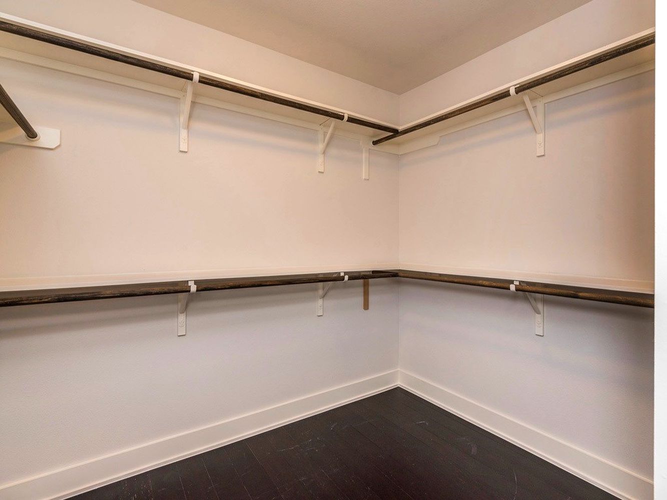 1182 Ridgeway Drive, Unit A Austin, TX 78702 - Photo 17 of 27 Walk in closet with dark wood-type flooring