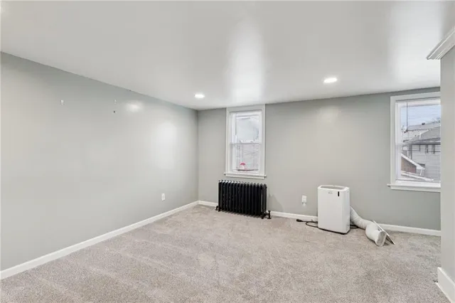a view of a livingroom with a projector and furniture