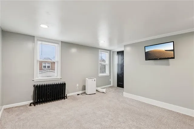 a view of empty room with a bathroom