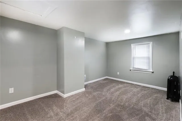 a view of an empty room and closet