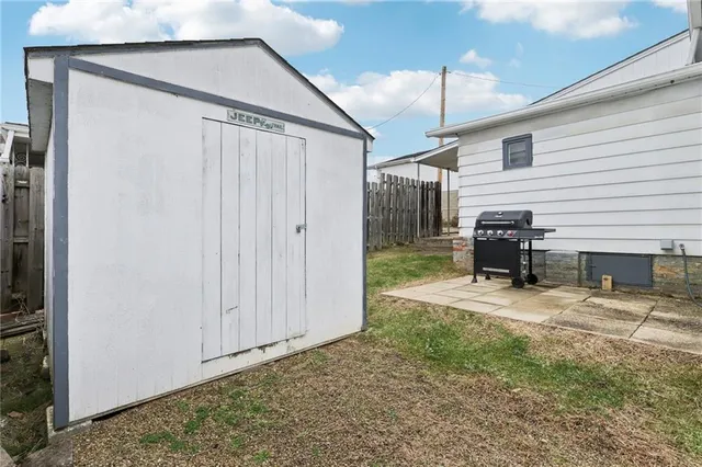a view of a chairs and a tables in the back yard