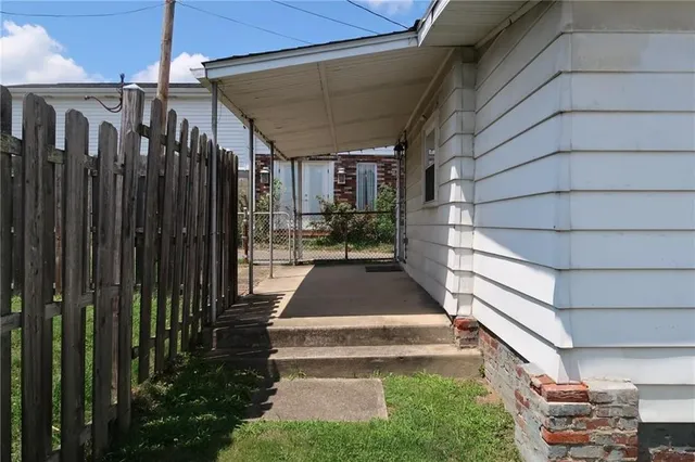 a porch with a table in the patio