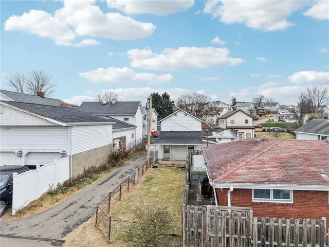 an aerial view of residential building and lake