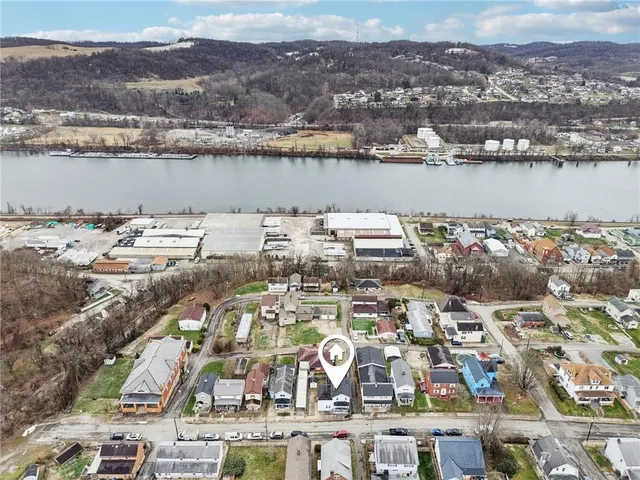 a picture of a bathroom with a refrigerator